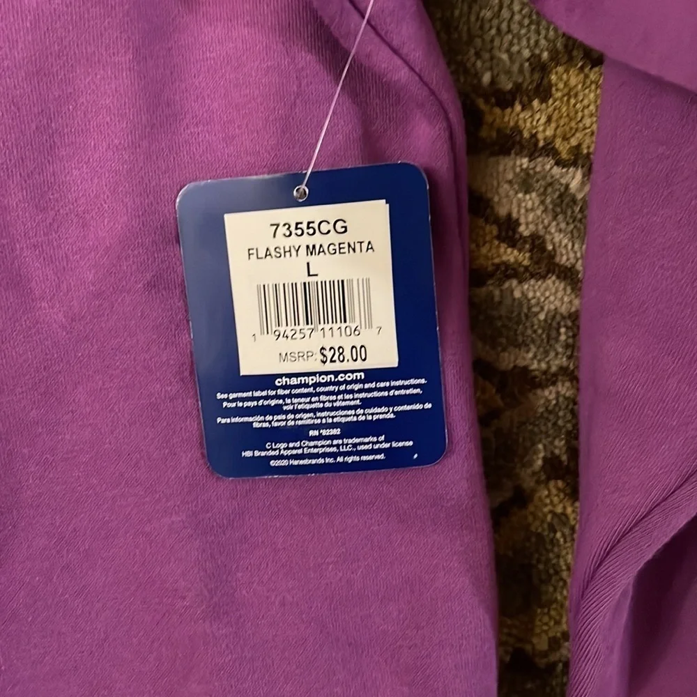 Children’s magenta long sleeved sweatshirt by Champion. Size large.NWT.